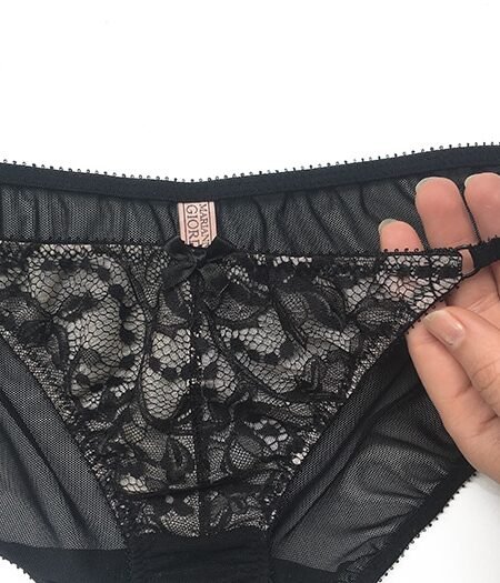 Sheer black panties bow details