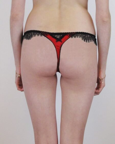 silk red thong with black lace details on the back