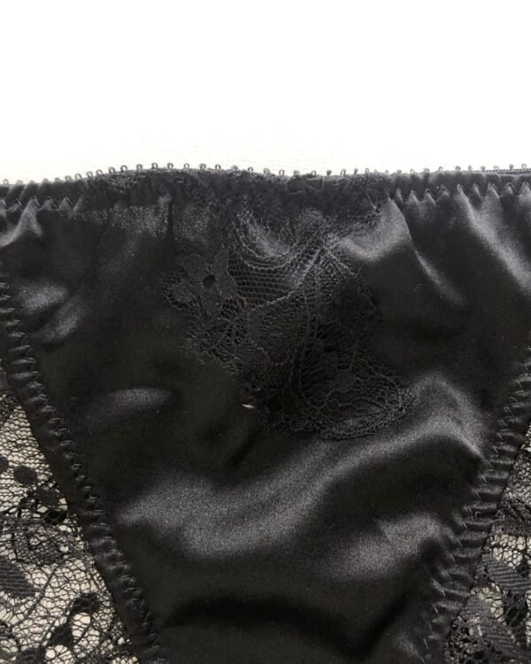Black short in silk and lace close up