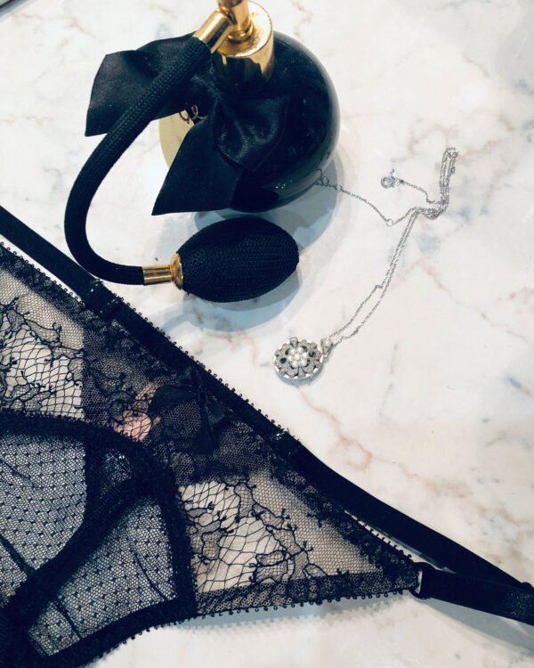 Sheer black lace Gstring flatlay